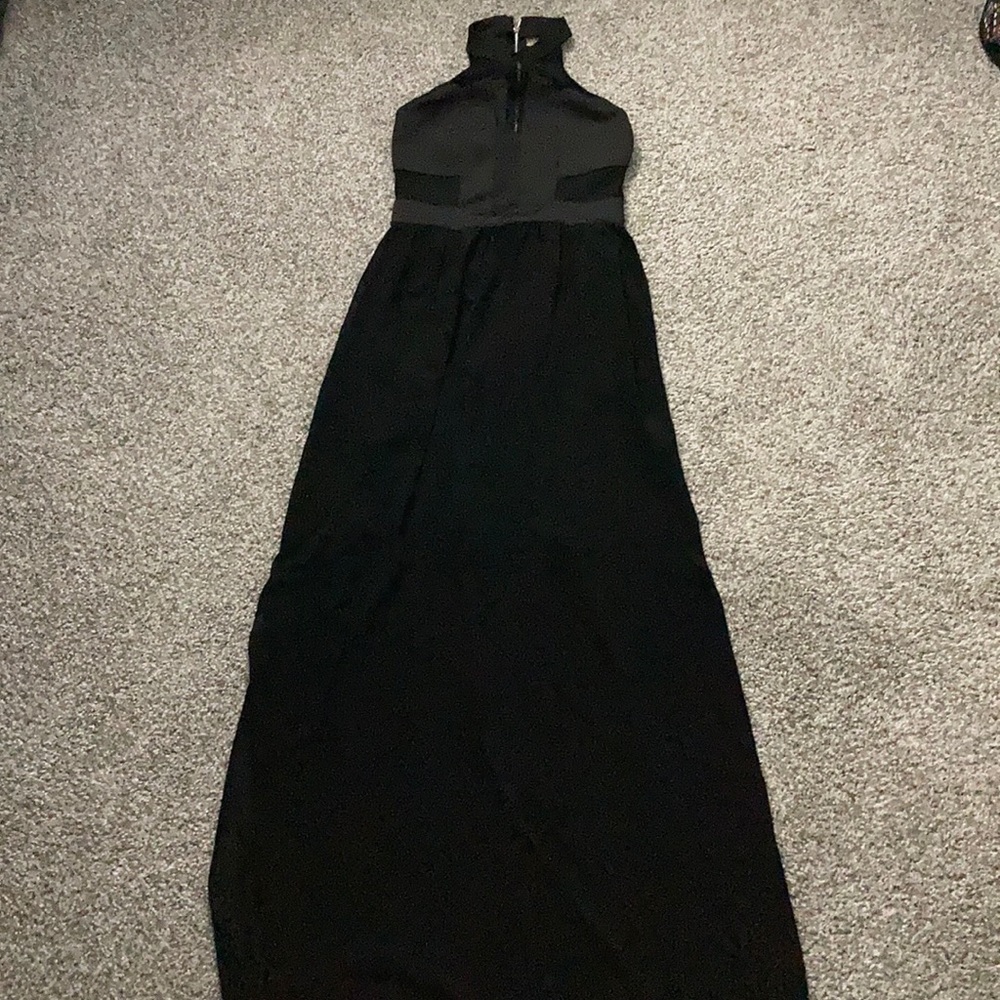 Long black dress, see thru below the knee.